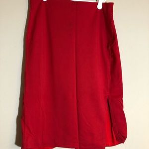 Red pencil skirt with slit.
